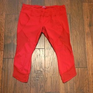 Athleta women's Rust Colored Capri leggings with Sheer Patches size XL
